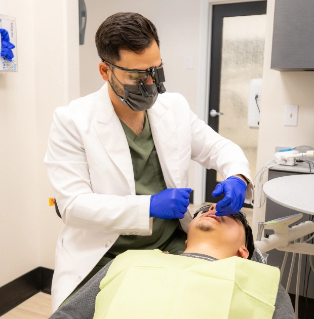 Emergency dentist providing urgent dental care to a patient