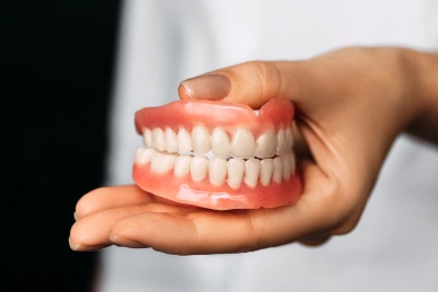 Full denture restoration providing a complete smile replacement