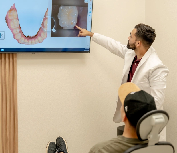 Dental hygienist performing a routine preventive care appointment
